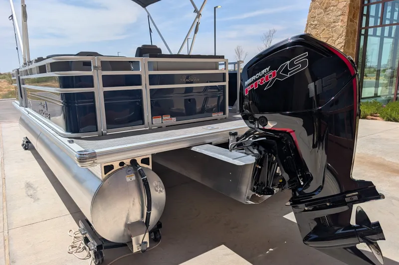 Slide: The Image of 2026 Sun Tracker SportFish 22 DLX pontoon boat with Mercury Pro XS 115 engine. - 96