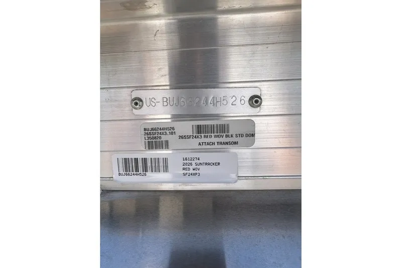 Slide: The Image of 2026 Sun Tracker Sportfish 24 XP3 identification labels on metallic surface. - 115