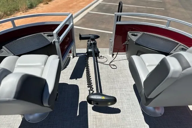 Slide: The Image of 2026 Sun Tracker Sportfish 24 XP3 pontoon boat interior with seating and trolling motor. - 15