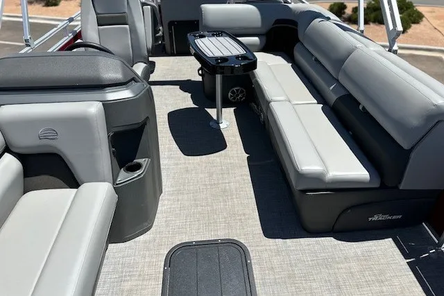 Slide: The Image of Interior of 2026 Sun Tracker Sportfish 24 XP3 pontoon boat with gray seating and table. - 18