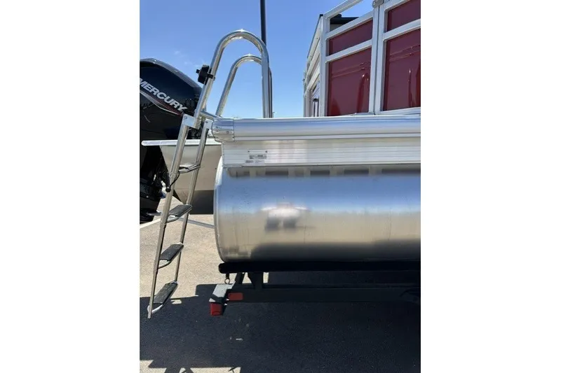 Slide: The Image of 2026 Sun Tracker Sportfish 24 XP3 pontoon boat with ladder and Mercury engine. - 117