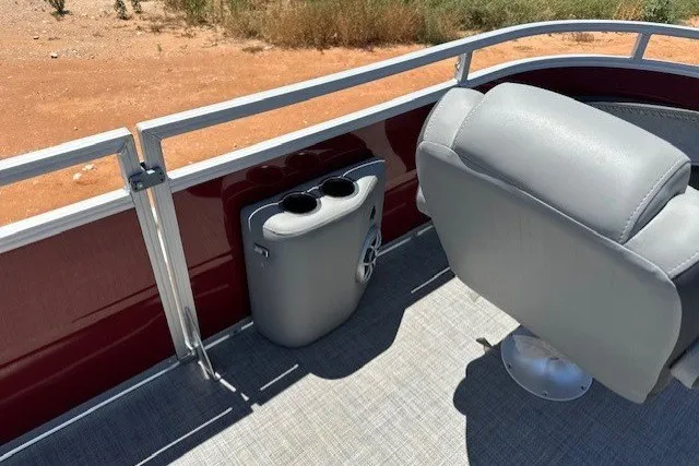 Slide: The Image of 2026 Sun Tracker Sportfish 24 XP3 boat interior with gray seating and cup holders. - 21