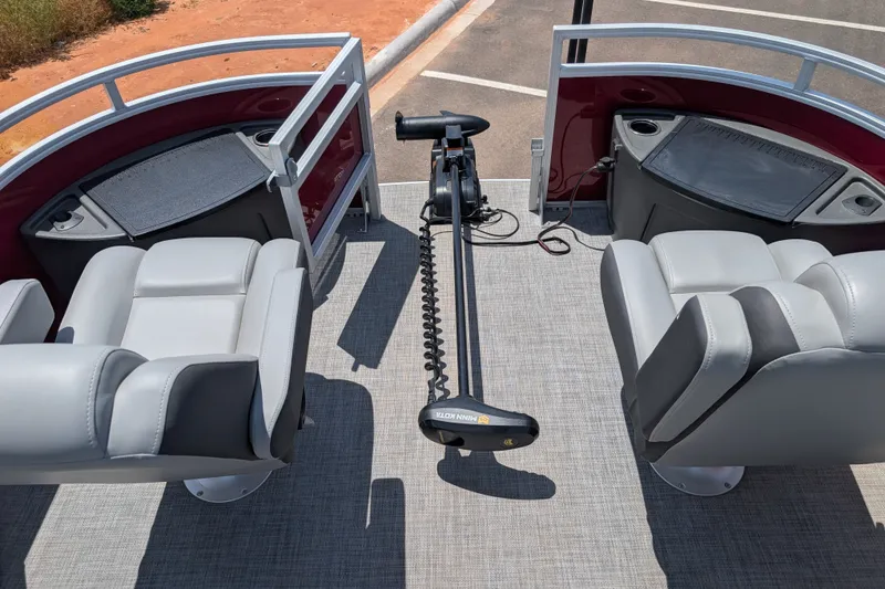 Slide: The Image of 2026 Sun Tracker Sportfish 24 XP3 boat interior with comfortable seating and trolling motor. - 113