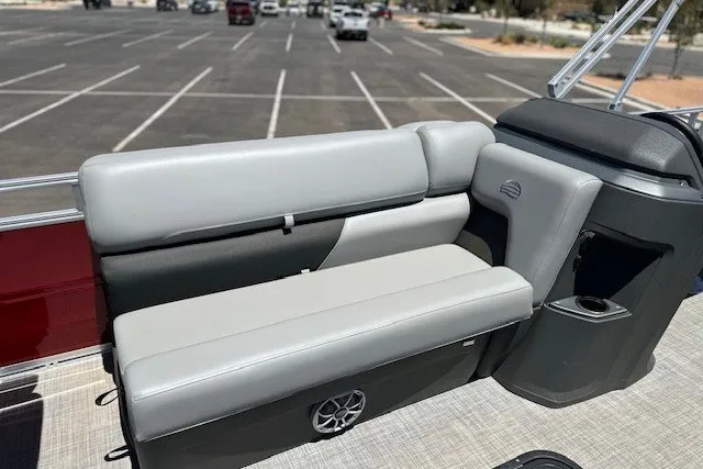 Slide: The Image of 2026 Sun Tracker Sportfish 24 XP3 boat interior with gray seating in a parking lot. - 23