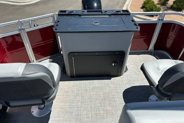 Slide: The Image of 2026 Sun Tracker Sportfish 24 XP3 boat interior with seating and storage area. - 26
