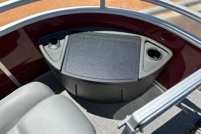 Slide: The Image of Close-up of a boat deck with storage compartment and cup holder. - 19