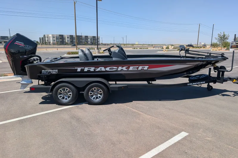 The Image of 2026 Tracker Savage 215 boat on trailer in parking lot. - 0