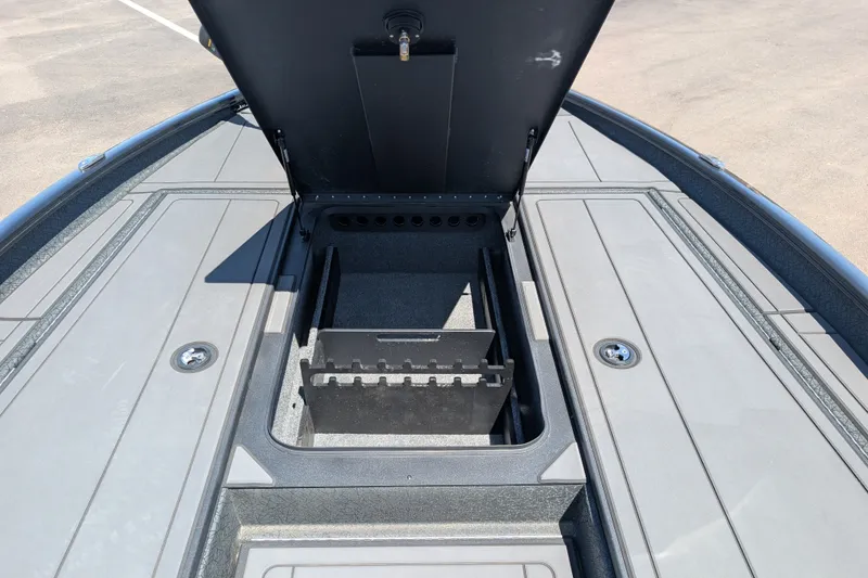Slide: The Image of Open storage compartment on 2026 Tracker Savage 215 boat deck. - 14