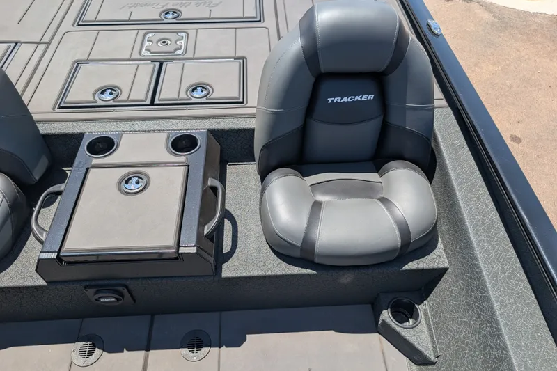 Slide: The Image of 2026 Tracker Savage 215 boat interior with cushioned seating and storage compartments. - 13