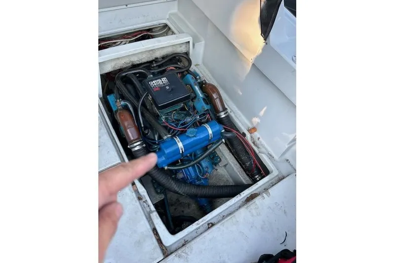 Slide: The Image of Engine compartment of a 1989 Rampage 28 Sportsman boat, showing detailed components. - 5