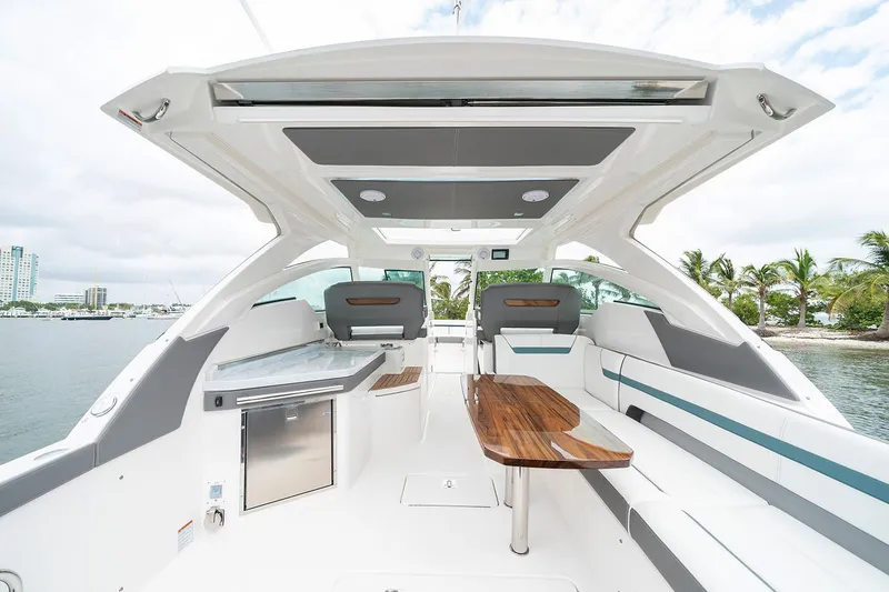 Slide: The Image of Manufacturer Provided Image: 2020 Tiara Sport 34 LX boat interior with seating and table. - 11