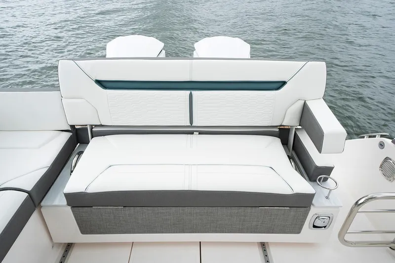 Slide: The Image of Manufacturer Provided Image: 2020 Tiara Sport 34 LX boat seating area with white and gray upholstery. - 13