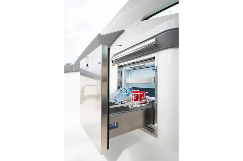Slide: The Image of Manufacturer Provided Image: 2020 Tiara Sport 34 LX boat with open stainless steel refrigerator drawer. - 16