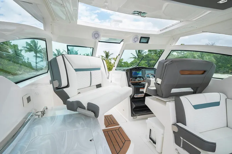 Slide: The Image of Manufacturer Provided Image: 2020 Tiara Sport 34 LX interior with luxurious seating and modern dashboard. - 7