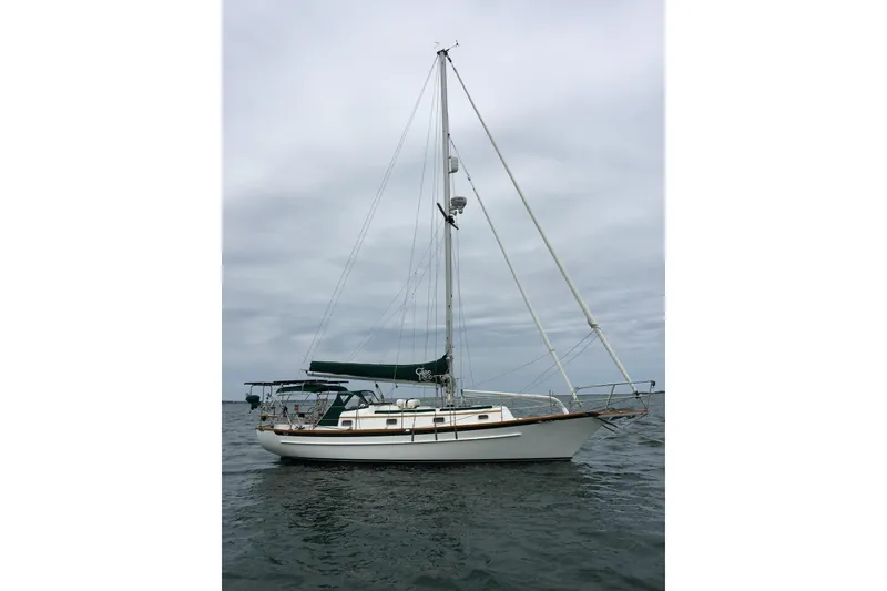 The Image of Sailboat on water, 1992 Cabo Rico 34, overcast sky. - 1