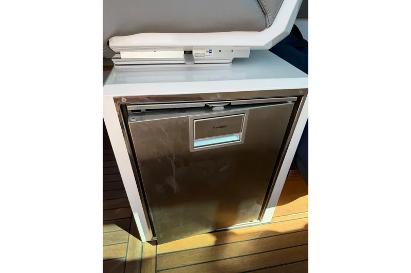 Slide: The Image of Stainless steel Dometic fridge in 2018 Axopar 37 Cabin boat interior. - 20