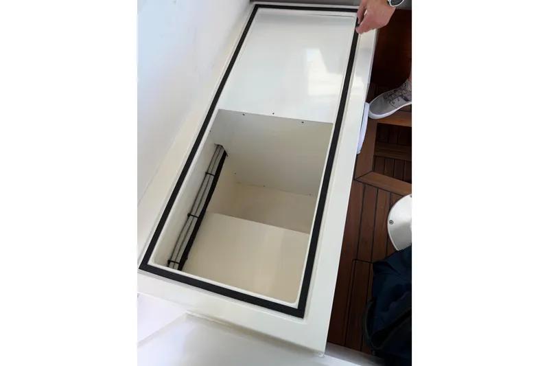 Slide: The Image of Storage compartment on 2018 Axopar 37 Cabin boat, featuring sleek design and ample space. - 26