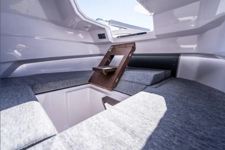 Slide: The Image of Interior cabin of 2027 Axopar 29 Sun-Top boat with seating and storage. - 10
