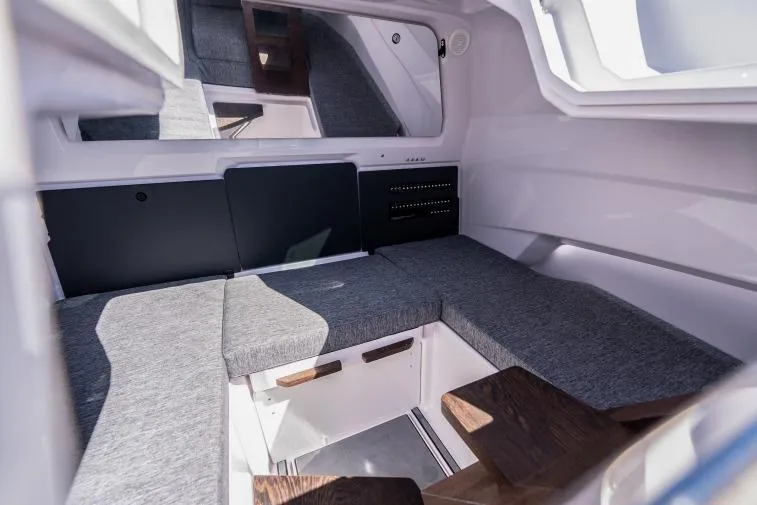Slide: The Image of Interior of 2027 Axopar 29 Sun-Top boat, featuring sleek seating and modern design. - 11
