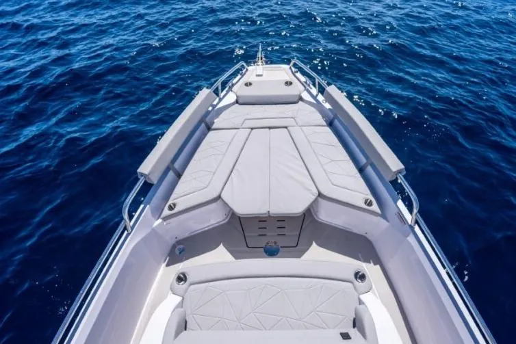 Slide: The Image of 2027 Axopar 29 Sun-Top boat with spacious deck on open sea. - 3
