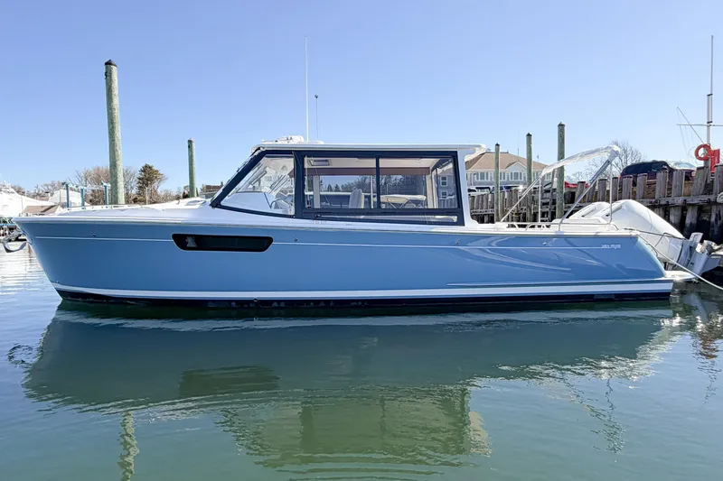 The Image of 2026 MJM 38x boat docked in calm waters, showcasing sleek design and modern features. - 0