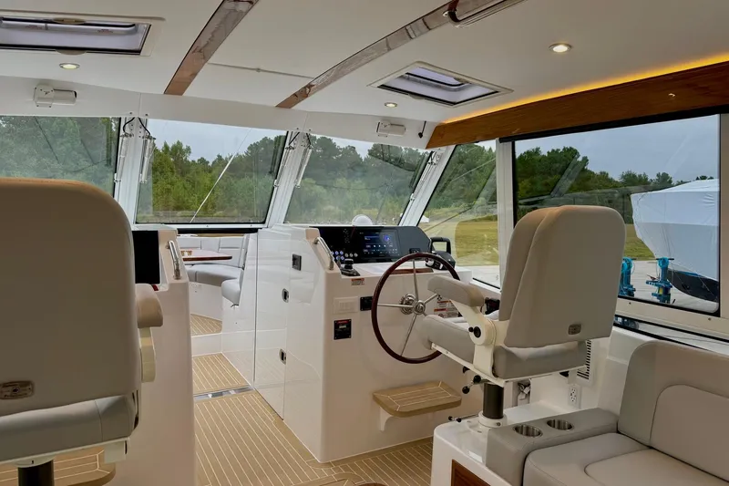 Slide: The Image of Interior of 2026 MJM 38x yacht with modern helm and seating. - 1