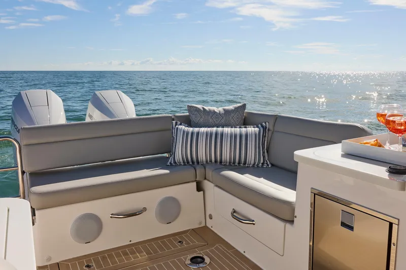 Slide: The Image of Luxury seating on MJM 38x boat, ocean view, 2026 model, with drinks and snacks. - 15