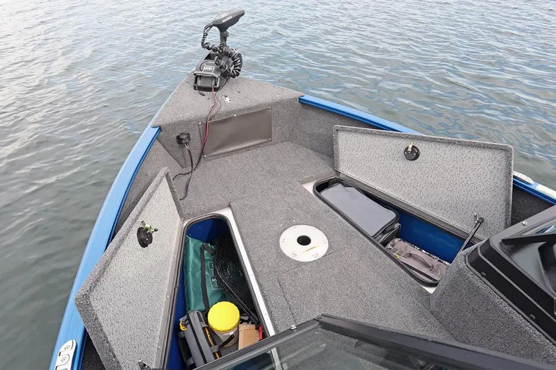 Slide: The Image of Manufacturer Provided Image: 2025 Lund 1675 Adventure Sport boat with open storage compartments on calm water. - 3