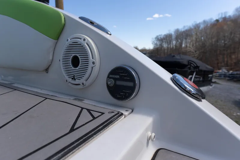 Slide: The Image of 2017 Starcraft Crossover 231 SCX IO SURF boat dashboard with speaker and controls. - 15