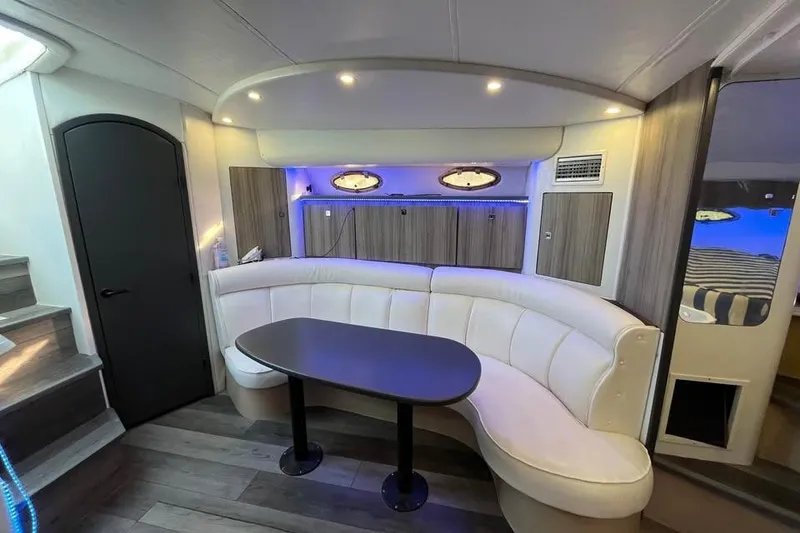 Slide: The Image of Interior of 2001 Cruisers Yachts 3870 Express with modern seating and ambient lighting. - 11