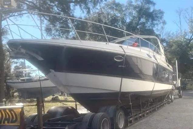 Slide: The Image of 2001 Cruisers Yachts 3870 Express on trailer, side view. - 2