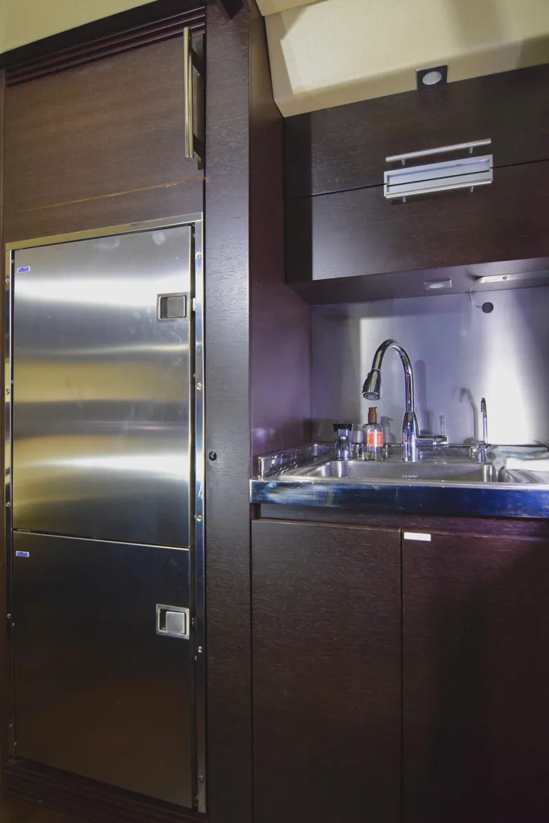Slide: The Image of Modern kitchen area in a 2010 Azimut 62S yacht with stainless steel appliances. - 26