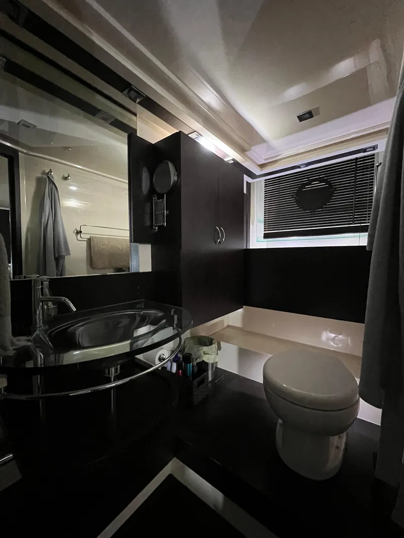 Slide: The Image of Modern bathroom in a 2010 Azimut 62S yacht with sleek fixtures and ample lighting. - 32