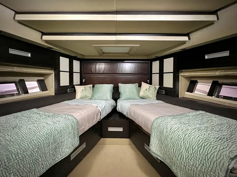 Slide: The Image of Luxurious twin bedroom in a 2010 Azimut 62S yacht with modern decor. - 33