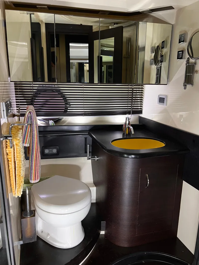 Slide: The Image of Modern bathroom in 2010 Azimut 62S yacht with sleek fixtures and ample storage. - 37