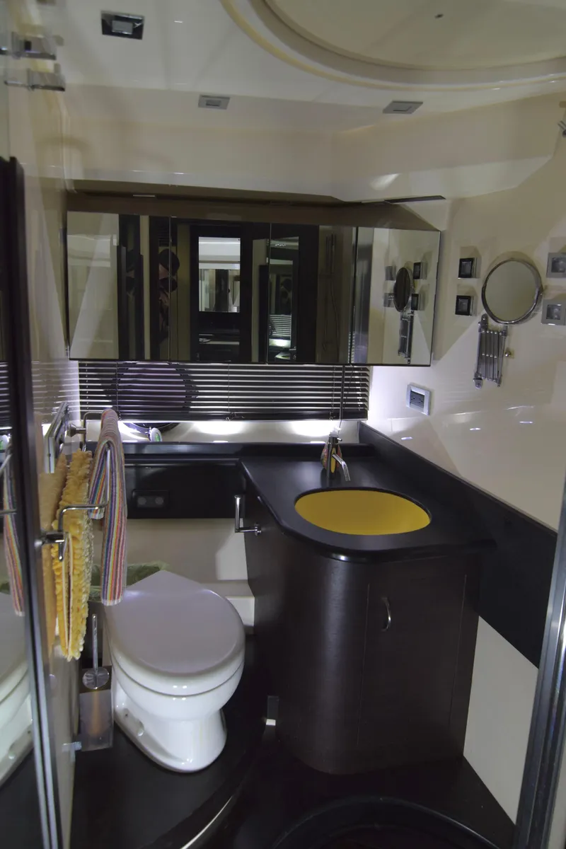 Slide: The Image of Luxurious bathroom in a 2010 Azimut 62S yacht with modern fixtures and sleek design. - 38
