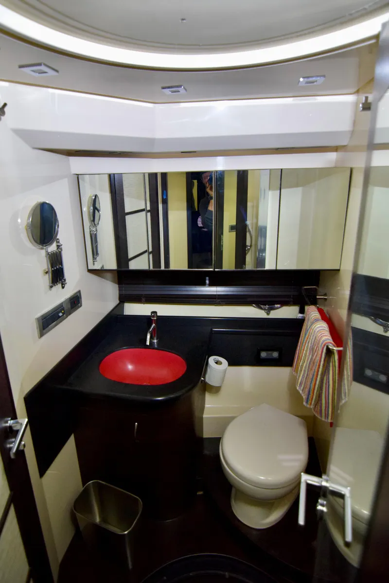 Slide: The Image of 2010 Azimut 62S yacht bathroom with modern fixtures and red sink. - 39
