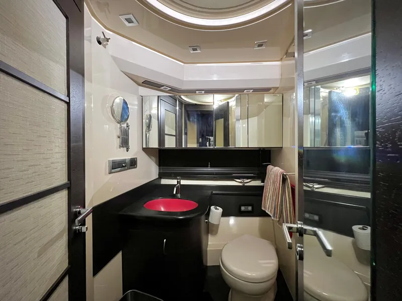 Slide: The Image of Luxurious bathroom in a 2010 Azimut 62S yacht with modern fixtures and red sink. - 40