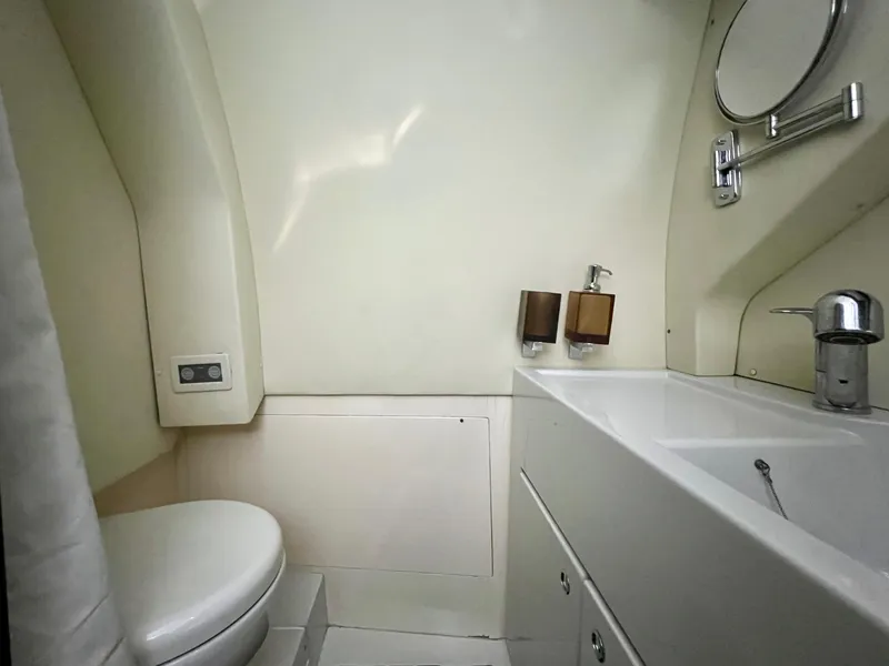 Slide: The Image of Modern bathroom in a 2010 Azimut 62S yacht with sink and toilet. - 43