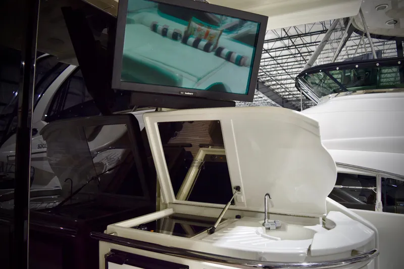 Slide: The Image of 2010 Azimut 62S yacht interior with TV and sink in a marina. - 7