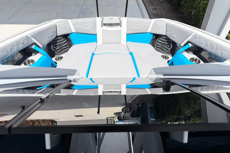 Slide: The Image of 2025 Nautique Super Air Nautique G25 Paragon boat interior with blue and gray seating. - 5