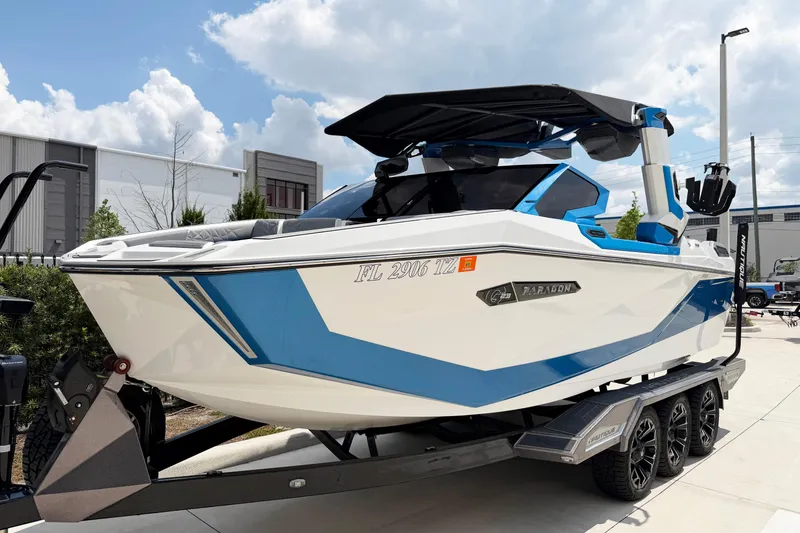 Slide: The Image of 2025 Nautique Super Air Nautique G25 Paragon boat on trailer, showcasing sleek design. - 1