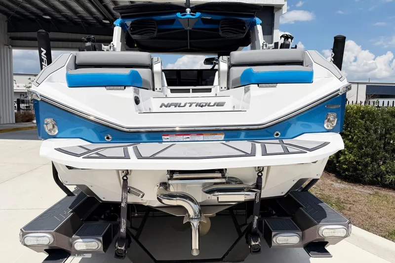 Slide: The Image of 2025 Nautique Super Air Nautique G25 Paragon boat rear view, showcasing sleek design and features. - 2