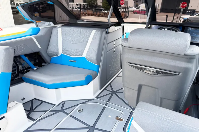Slide: The Image of Interior of 2025 Nautique Super Air Nautique G25 Paragon boat, featuring modern seating. - 7
