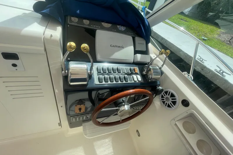 Slide: The Image of 2001 Tiara Yachts 2900 Coronet helm with Garmin navigation and classic wooden steering wheel. - 16