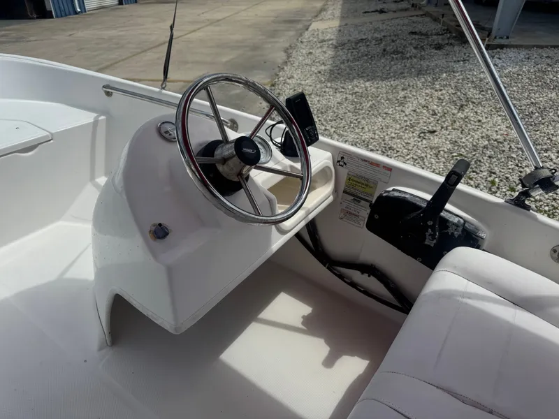 Slide: The Image of Interior view of a 2009 Boston Whaler 13 Sport boat. - 6