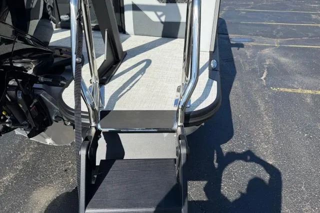 Slide: The Image of Alera M 23Q 2026 boat with a boarding ladder and shadow on pavement. - 13