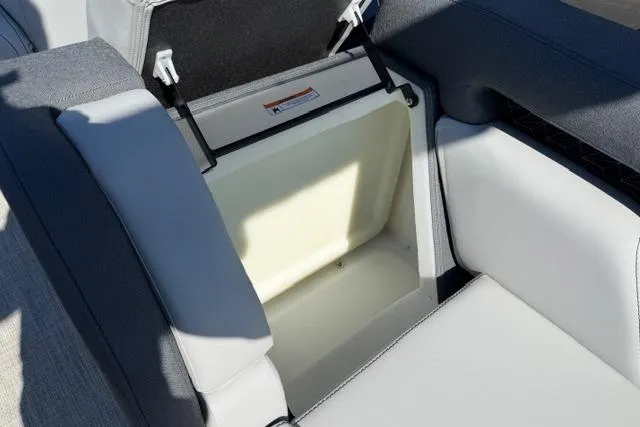 Slide: The Image of Open storage compartment in 2026 Alera M 23Q boat seat. - 19
