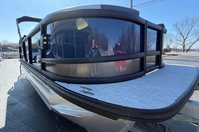 Slide: The Image of Alera M 23Q 2026 pontoon boat with sleek design and modern features. - 2