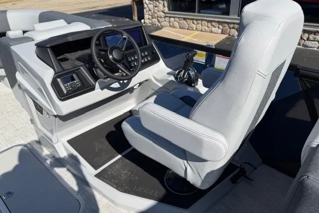 Slide: The Image of Cockpit of 2026 Alera M 23Q boat with modern steering and controls. - 21